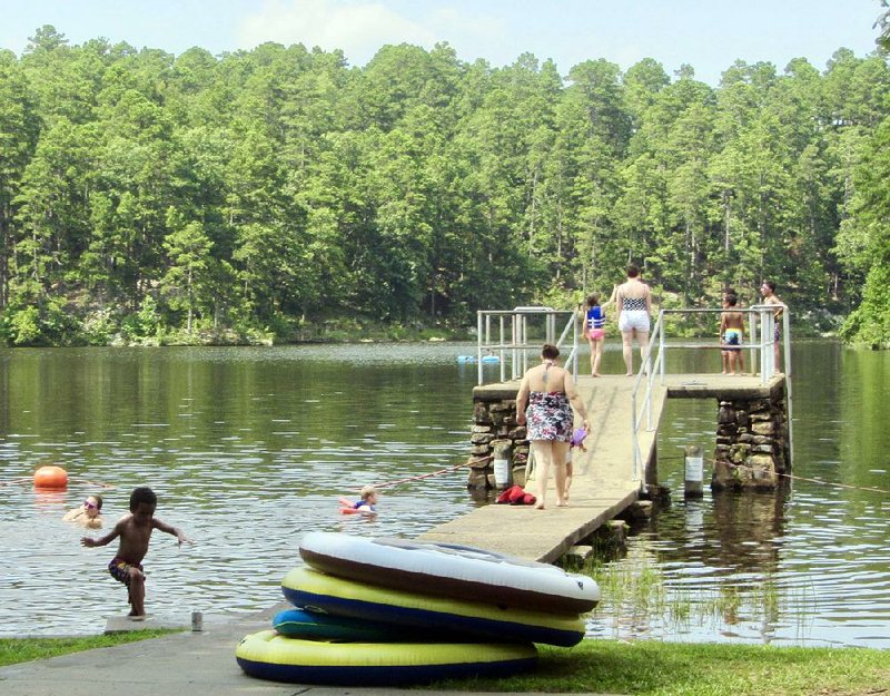 Kids and grown-ups enjoy the water on a July afternoon at Lake Sylvia, located in Ouachita National Forest.