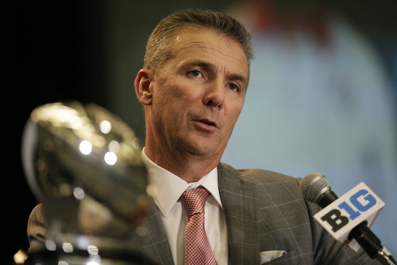 The Associated Press EQUAL FOOTING: Ohio State NCAA college football head coach Urban Meyer speaks at Big Ten Media Day in Chicago Monday. Meyer said that he believed the Big Ten is as strong as the SEC.