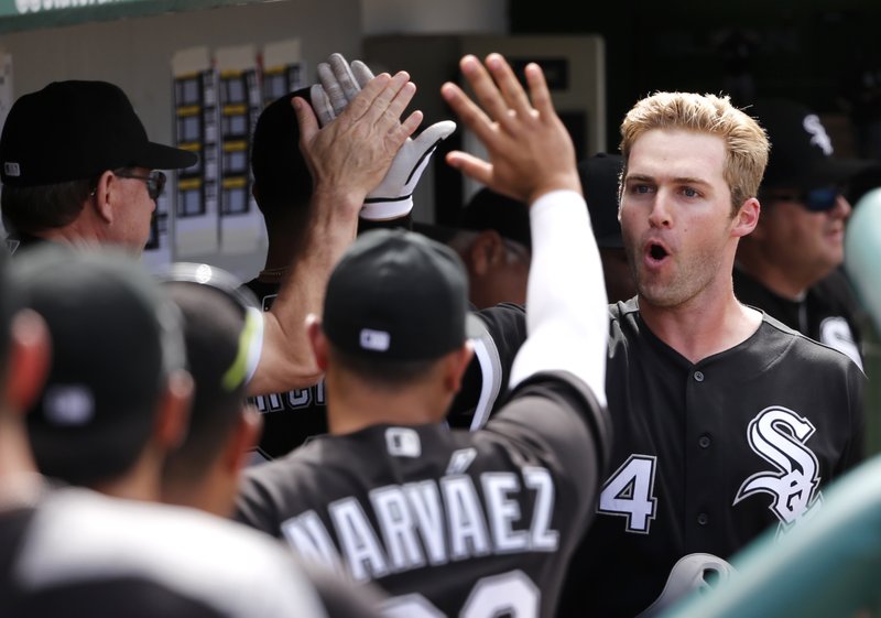 The Associated Press MAN OF THE HOUR: Chicago White Sox's Matt Davidson, right, celebrates in the dugout after his home run off Chicago Cubs relief pitcher Koji Uehara during the eighth inning Monday in Chicago. Davidson's home run put the White Sox ahead 3-1, securing the team's win over the Cubs.