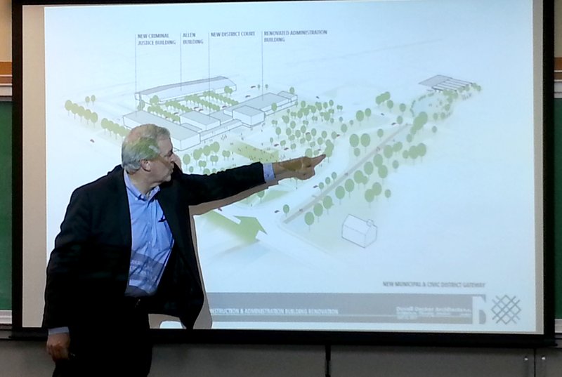 NWA Democrat-Gazette/HICHAM RAACHE
Roy Decker of Duvall Decker, a Jackson, Miss., architecture firm, shows Springdale city leaders schematic designs for a Municipal Complex, which includes a new Criminal Justice Building Monday, July 24, 2017 during a meeting in the city's multipurpose room.