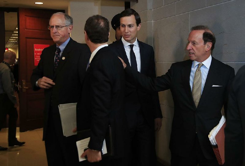 Jared Kushner (center) and his attorney, Abbe Lowell (right), talk with House Intelligence Committee members Michael Conaway (left), R-Texas, and Adam Schiff (back to camera), D-Calif., after Kushner met with the committee Tuesday.  