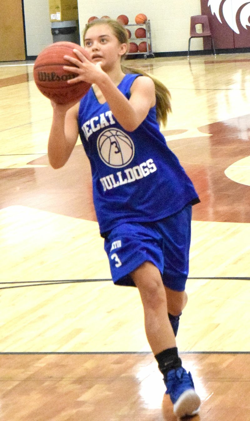 Photo by Mike Eckels Decatur&#8217;s Destiny Meija (3) lines up a shot from inside the foul line during the Decatur-Lincoln team camp competition in the gym at Lincoln High School July 21.