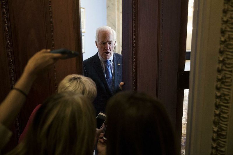 “This is a high-wire act — the whole thing,” Senate Majority Whip John Cornyn said of efforts to rewrite the health care law, during a meeting with reporters Wednesday outside his Capitol Hill office. 