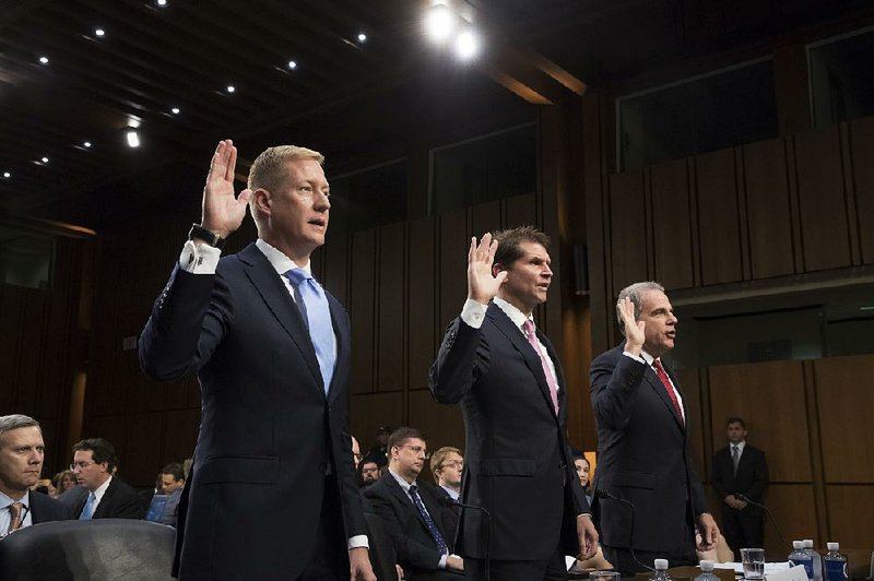 Adam Hickey (left), a deputy assistant attorney general, is sworn in Wednesday by the Senate Judiciary Committee along with Bill Priestap (center), assistant director of the FBI Counterintelligence Division, and Michael Horowitz, inspector general at the Justice Department. 


