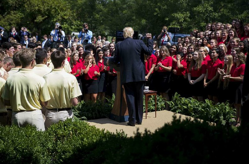 President Donald Trump speaks Wednesday to a gathering of the American Legion Boys Nation and the American Legion Auxiliary Girls Nation in the White House Rose Garden hours after his proclamation on transgender military personnel. Trump said in a tweet that he reached the decision in consultation with “my generals and military experts.”  