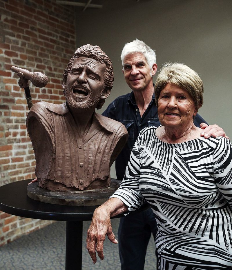 Kevin Kresse and Anna Lee Amsden pose with a bust of the late musician Levon Helm on Wednesday.  

