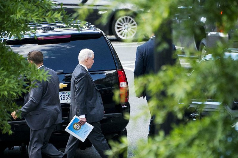 Attorney General Jeff Sessions leaves the White House on Wednesday morning as President Trump’s public criticism of him continued.


