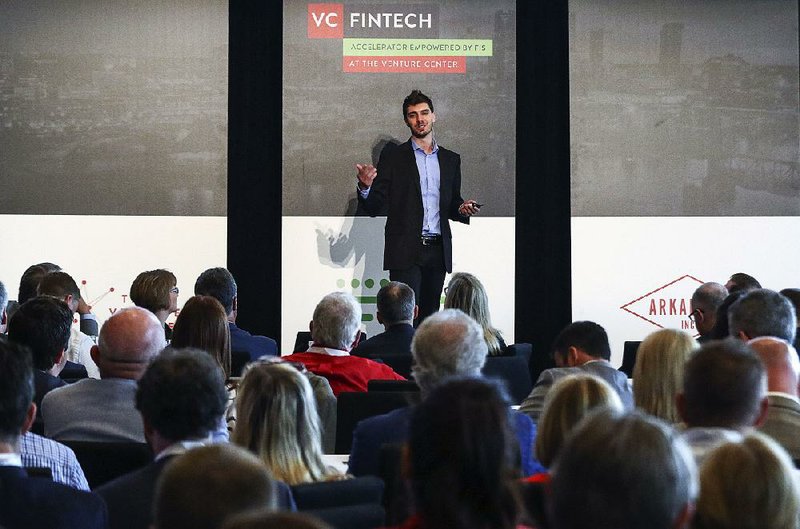 Brian Ley, founder and chief executive officer of Alpharank, pitches his business Wednesday to a crowd of potential investors during the VC FinTech Demo Day at the Clinton Presidential Center in Little Rock. 
