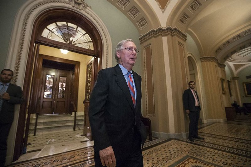 Senate Majority Leader Mitch McConnell leaves the Senate chamber Thursday in Washington as the debate to overhaul the Affordable Care Act continues.