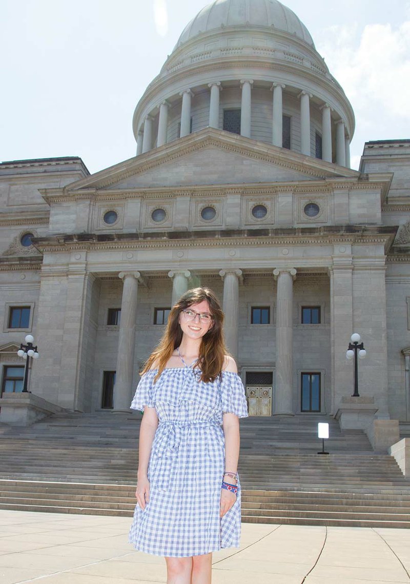 Julia Nall of Bryant stands in front of the Arkansas Capitol in Little Rock. Nall helped start the Young Democrats club at Bryant High School and was elected national committeewoman from Arkansas for the Young Democrats of America. Nall will attend the University of Arkansas at Fayetteville this fall. She wants to study political science and international studies.