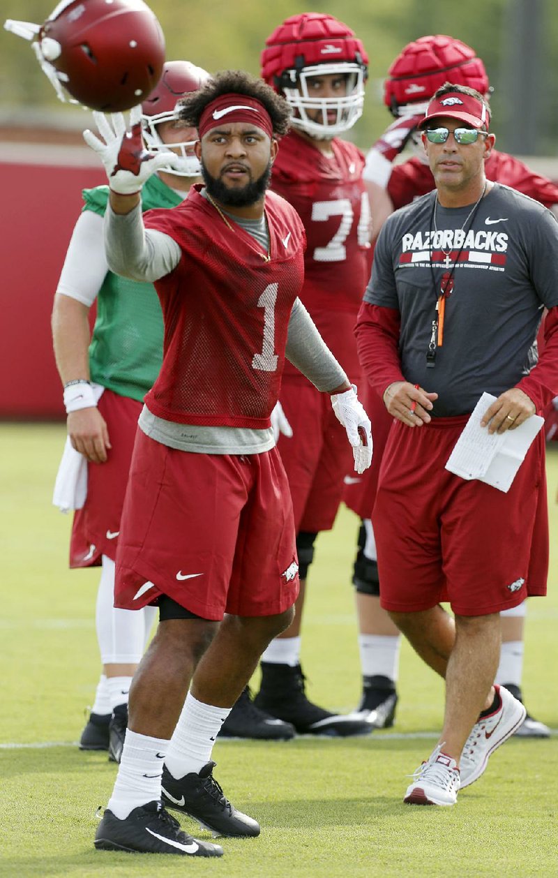 Arkansas wide receiver Jared Cornelius (1) will not practice for an extended period while he deals with back tightness. 