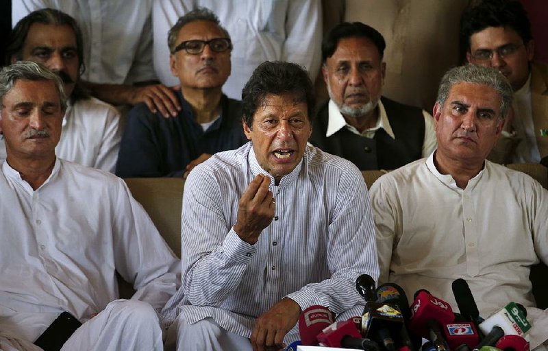 Opposition leader Imran Khan (center) said Friday in Islamabad that Prime Minister Nawaz Sharif’s removal was a “good omen” for Pakistan.