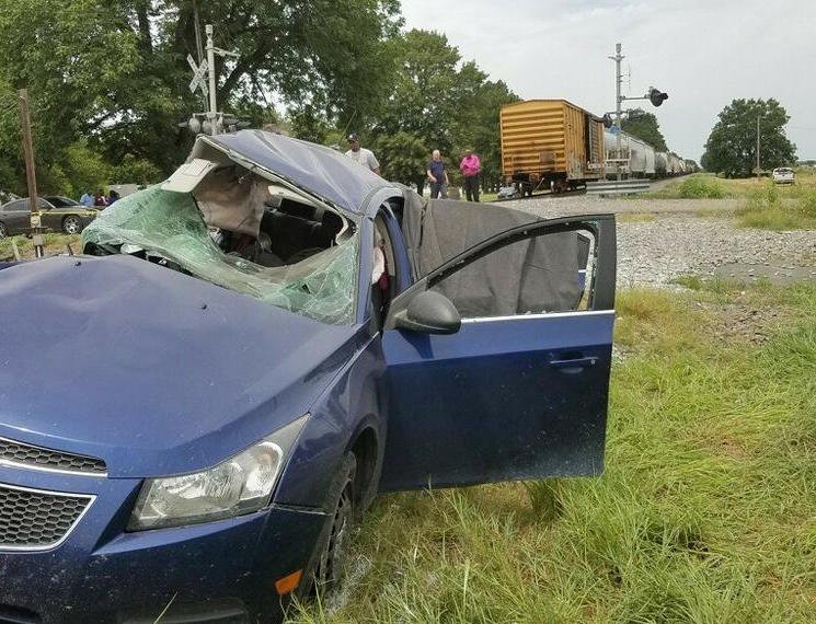 This photo released by the Jefferson County sheriff's office shows the scene of a train-car collision that killed two people.