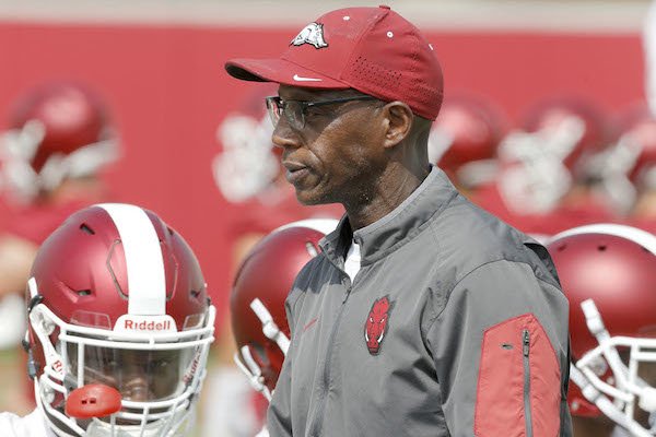 Arkansas Razorback running back coach Reggie Mitchell at the beginning of drills Friday, July 28, 2017, during practice on campus in Fayetteville.