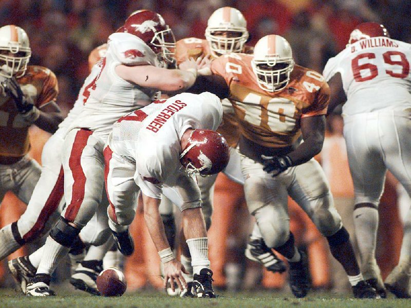 Arkansas quarterback Clint Stoerner fumbles in the fourth quarter against Tennessee in 1998. The top-ranked Volunteers recovered with 1:43 remaining and rallied to avoid the upset, taking a 28-24 victory en route to winning the national title. “We had the No. 1 team in the country beat and I couldn’t hold onto the ball,” Stoerner said.