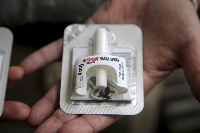In this June 14, 2017, photo, Cook County Sheriff Tom Dart shows Naloxone, an overdose-reveal nasal spray drug at the sheriff's office in Cook County Jail, the largest single site jail in the United States, has joined the growing number of jails to hand to inmates on their way out the door kits containing naloxone. (AP Photo/G-Jun Yam)