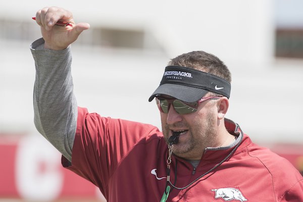 Arkansas coach Bret Bielema gestures during practice Saturday, July 29, 2017 in Fayetteville.