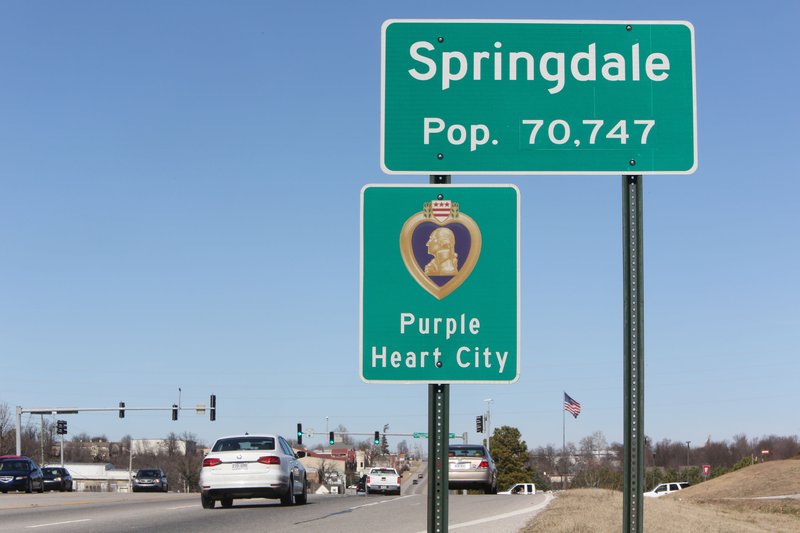 NWA Democrat-Gazette/DAVID GOTTSCHALK   A sign post marking the city limits of Springdale Thursday, February 16, 2017, on South Thompson Boulevard in Springdale. 