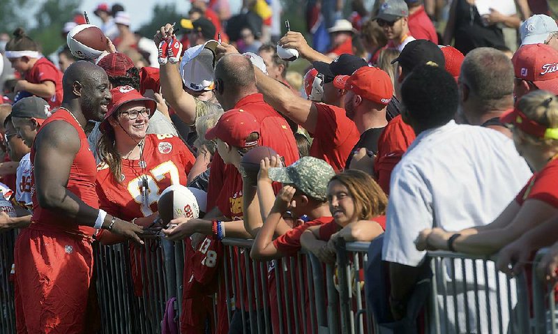 Kansas City Chiefs linebacker Justin Houston (left) meets with fans Friday afternoon at the team’s training camp in St. Joseph, Mo. Houston, who struggled with a knee injury for a second consecutive season, had four sacks in five games last season.