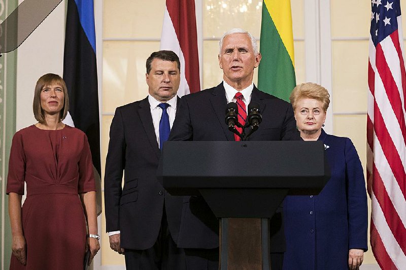 U.S. Vice President Mike Pence (second from right) accompanied by the leaders of Baltic states (from left) Estonian President Kersti Kaljulaid, Latvian President Raimonds Vejonis and Lithuanian  President Dalia Grybauskaite, speaks during a news conference  after their meeting in the Kadriorg Palace in Tallinn, Estonia, on  Monday. 