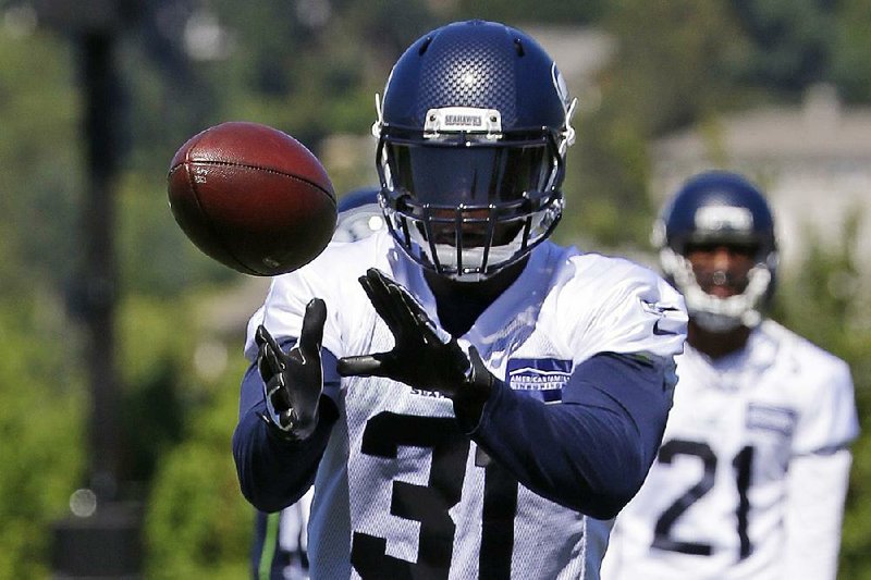 Seattle strong safety Kam Chancellor signed a three-year extension with the Seahawks on Tuesday worth up to $36 million with $25 million guaranteed. 