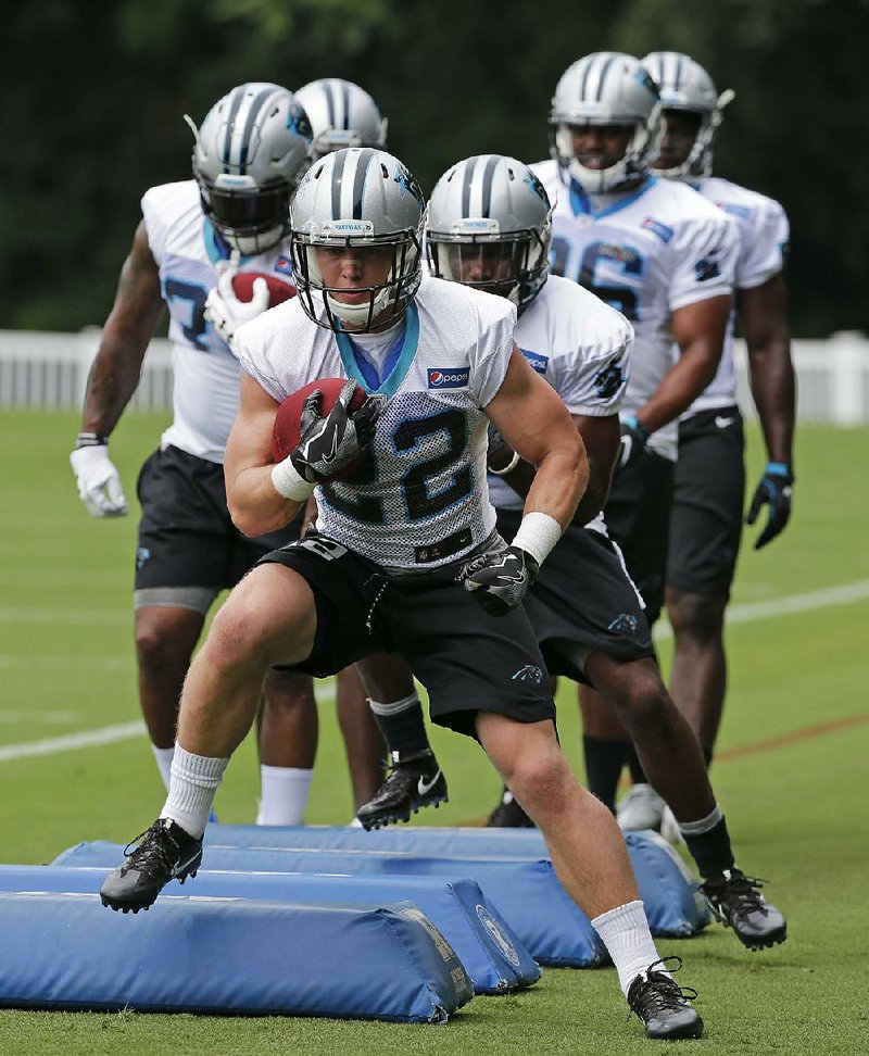 Carolina Panthers running back Christian McCaffrey (22) is drawing rave reviews about his athleticism from veteran players and coaches during his first week of training camp. 
