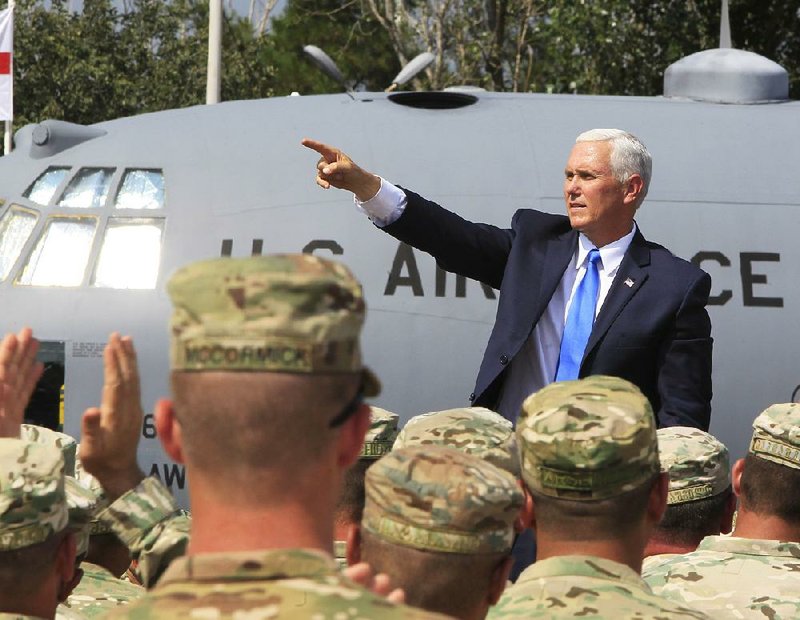 Vice President Mike Pence greets servicemen participating in a joint military exercise Tuesday outside Tbilisi, Georgia.