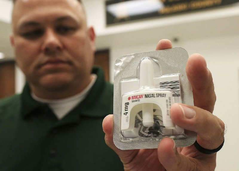 Maj. Carl Minden of the Pulaski County sheriff’s office displays a Narcan kit Tuesday. Authorities say the nasal spray medication has saved multiple people in Pulaski County from opioid overdoses. 