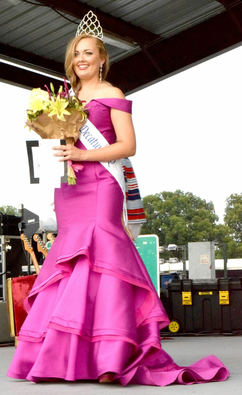 Photo by Mike Eckels Sara Garner from Fayetteville walked around the stage at Veterans Park in Decatur last summer after winning the Miss Decatur Barbecue crown. Garner will soon give up her title as a new Miss Decatur Barbecue will be crowned during the 64th Annual Decatur Barbecue August 5 at Veterans Park.