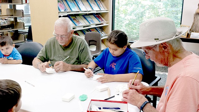 Photo Submitted. The Bella Vista Woodcarver&#8217;s Club came out to the Bella Vista Public Library to teach the basics of carving&#8230;with soap!
