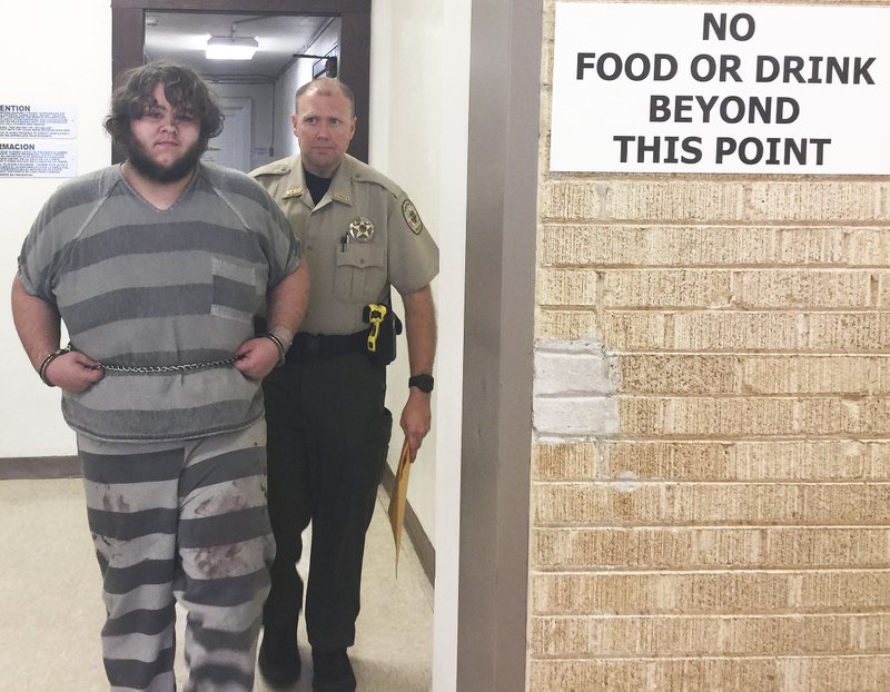 Patrick Malone, 20, of Garfield is escorted Tuesday by a Benton County Sheriff's Office deputy after his court appearance in connection with capital murder. He is accused of killing his mother. Circuit Judge Xollie Duncan set Malone's bond at $250,000.