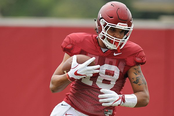 Arkansas tight end Jeremy Patton makes a catch Tuesday, Aug. 1, 2017, during practice at the university's practice field in Fayetteville. 
