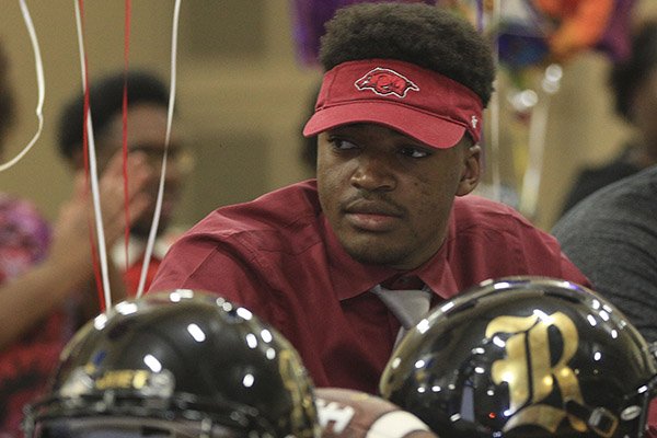 Joe T. Robinson defensive end David Porter watches during his signing ceremony on Wednesday, Feb. 1, 2017, in Little Rock. 