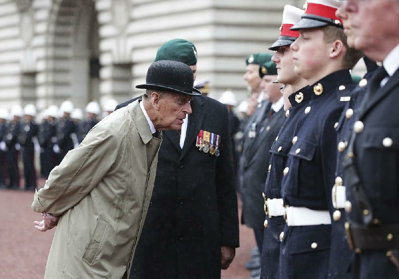 Britain’s Prince Philip, in his role as captain general of the Royal Marines, talks to troops as he attends a parade on the forecourt of Buckingham Palace on Wednesday in central London. 