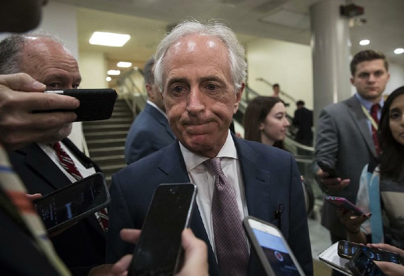 Sen. Bob Corker, R-Tenn., chairman of the Foreign Relations Committee and a driving force behind the Russia sanctions bill, talks to reporters Wednesday on Capitol Hill. 