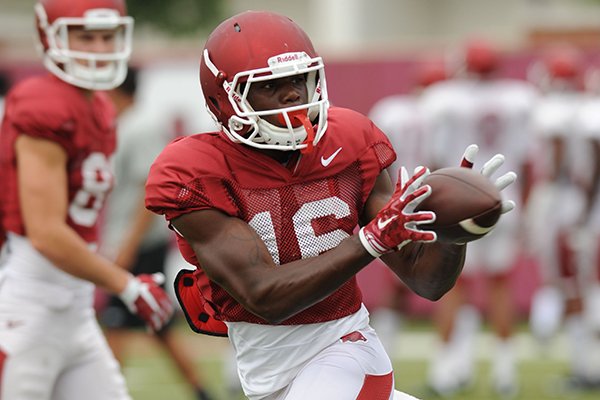 Arkansas receiver La'Michael Pettway makes a catch Tuesday, Aug. 18, 2015, during practice at the university's practice field in Fayetteville.
