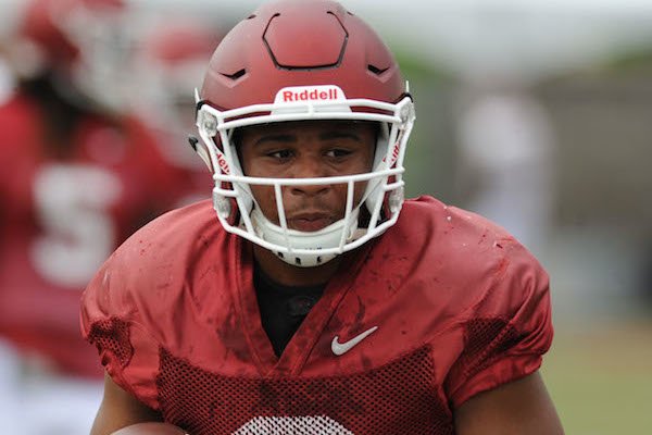 Arkansas receiver Koilan Jackson carries the ball Tuesday, Aug. 1, 2017, after making a catch during practice at the university's practice field in Fayetteville.