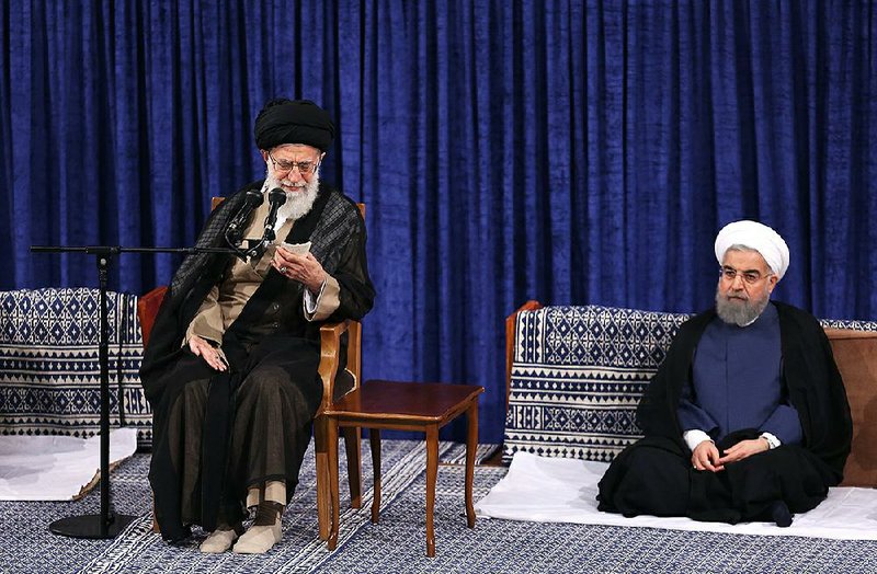 A ceremony Thursday in Tehran led by Iran’s supreme leader, Ayatollah Ali Khamenei, (left) marked the official endorsement of President Hassan Rouhani, (right) who said that in his second term Iran will “insist on constructive engagement.”