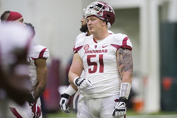 Arkansas offensive lineman Hjalte Froholdt (51) goes through practice Saturday, April 29, 2017, in Fayetteville. 