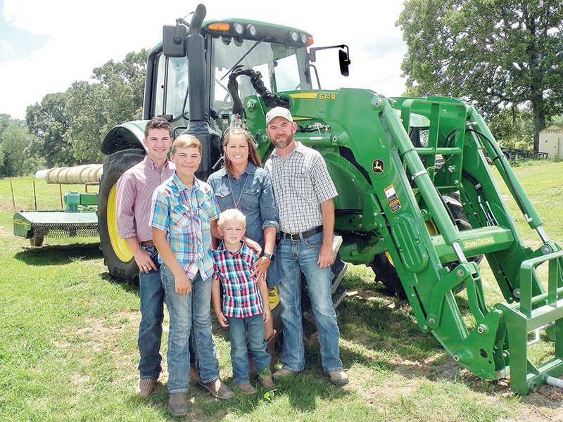 The Timothy “Timbo” Honeycutt family is the 2017 Conway County Farm Family of the Year. Members of the family include, front row, Wesley Honeycutt, left, and Nathan Honeycutt; and back row, from left, Preston Honeycutt, Minnie Honeycutt and Timbo Honeycutt. Not shown is Tiffany Duncan. The family raises hay, cattle and poultry.