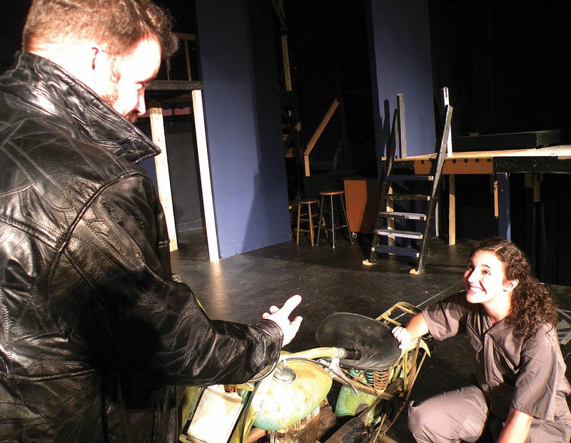 The Royal Players will present the musical All Shook Up on Thursday through Aug. 20 at the Royal Theatre in Benton. In this rehearsal scene, Chad, the roustabout, played by Alexander Harding Chandler, tries to entice Natalie, the mechanic, played by Hannah Hill, as she works on his motorcycle.