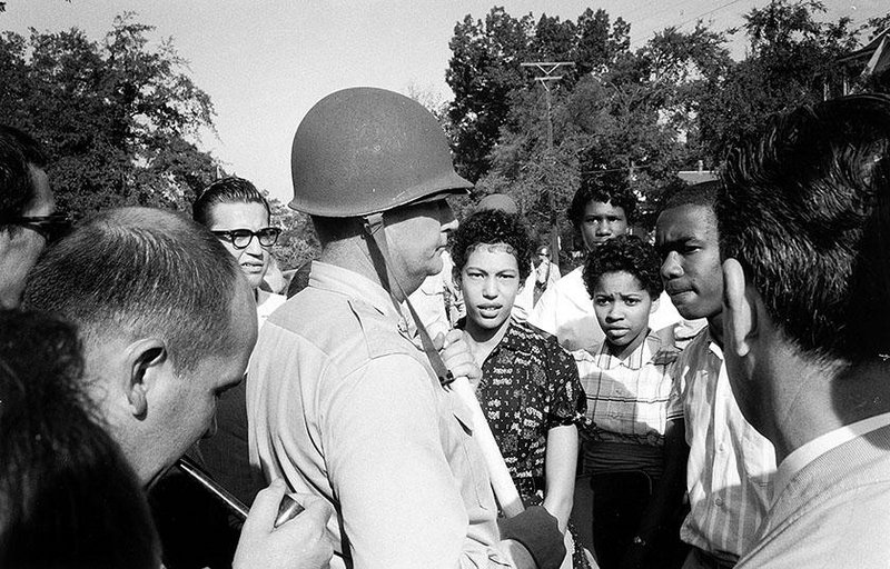 “Surrounded by newsmen … ” a 1997 silver gelatin print of a 1957 photo by Arkansas Democrat photographer Will Counts, is part of the “Will Counts: The Central High School Photographs” exhibit, opening Tuesday at the Arkansas Arts Center.
