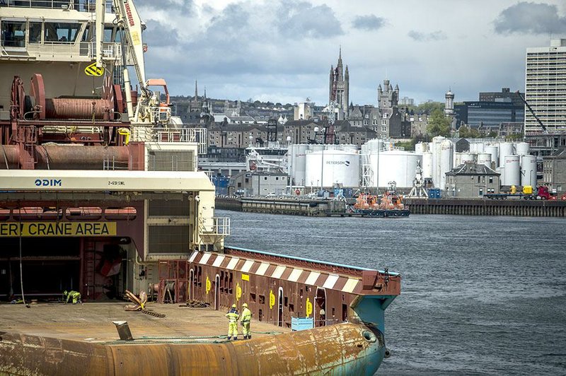 A ship enters the port of Aberdeen, Scotland, a hub for servicing North Sea oil platforms, in this photo from 2015. 
