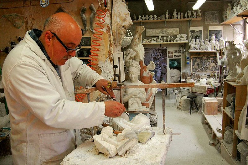 Artisans like this alabaster sculptor in Volterra, Italy, keep the local craft alive and provide meaningful souvenirs for travelers. 