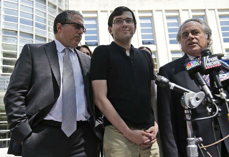 Martin Shkreli (center) arrives Friday at federal court in New York.