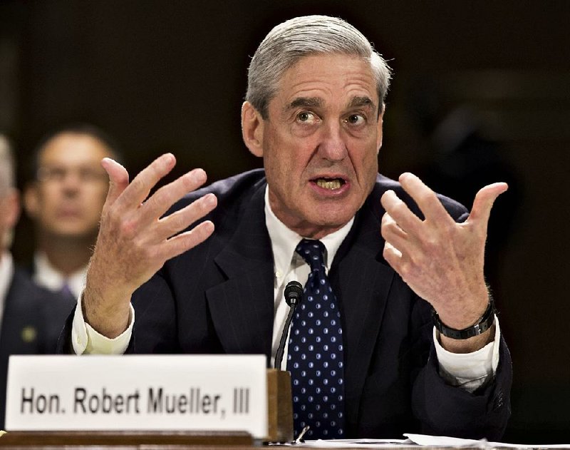 In this June 19, 2013, file photo, former FBI Director Robert Mueller testifies on Capitol Hill in Washington.