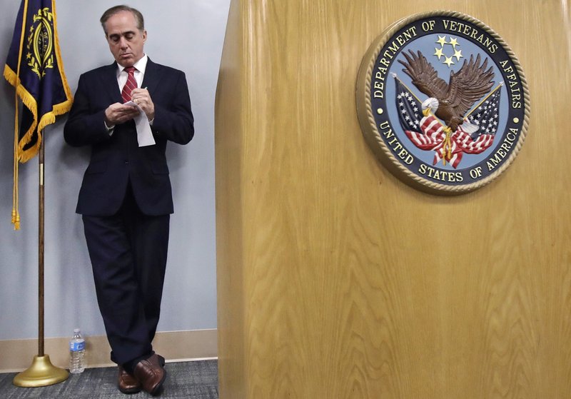 Secretary of Veterans Affairs David J. Shulkin takes notes during a visit to the Veterans Administration Medical Center in, Manchester, N.H., Friday, Aug. 4, 2017. Shulkin earlier met privately with doctors at the center, who have alleged substandard care at New Hampshire's only hospital for veterans. (AP Photo/Charles Krupa)