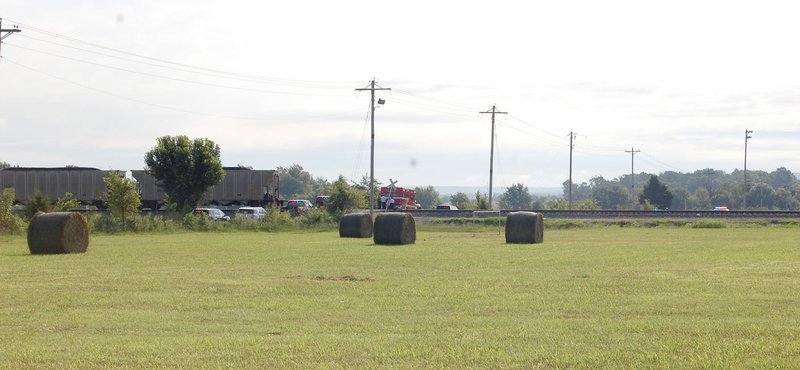 Graham Thomas/Siloam Sunday Emergency crews responded to a train-truck accident Friday morning near Industrial Park Road and Cemetery Road in Westville, Okla. Officials confirmed there was a fatality in the accident.