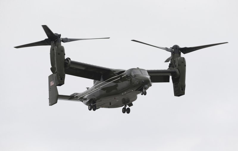 In this April 22, 2015 file photo, a Marine Corps MV-22 Osprey comes in for a landing at Miami International Airport before a presidential visit, in Miami.  