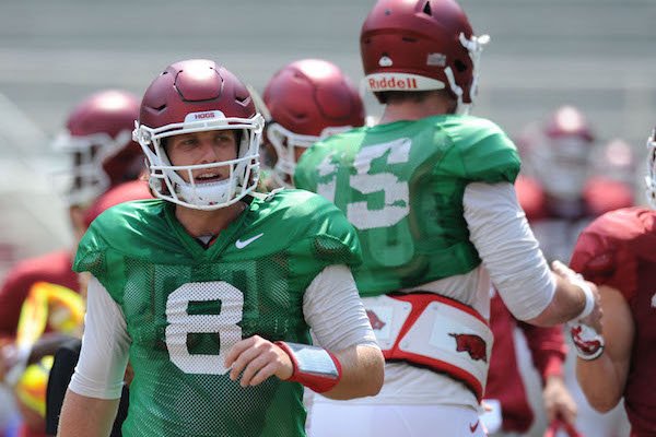 Arkansas quarterback Austin Allen returns to the sideline Saturday, Aug. 5, 2017, prior to the start of a scrimmage in Razorback Stadium in Fayetteville.